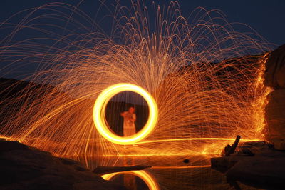 Light painting against sky at night