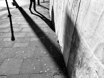 Low section of people walking on footpath