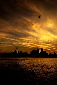 Silhouette of buildings at sunset