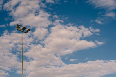 Low angle view of floodlight against sky