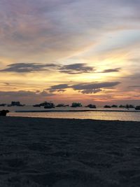 Scenic view of sea against sky at sunset