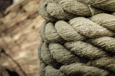 Close-up of rope tied up of stack