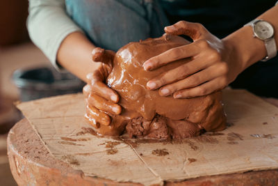 Midsection of potter making earthenware