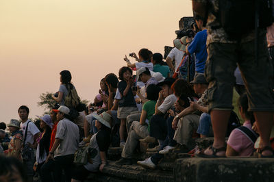 Tourists with sky in background