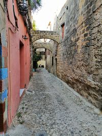 Narrow alley amidst buildings in town