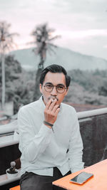 Man smoking cigarette outdoors