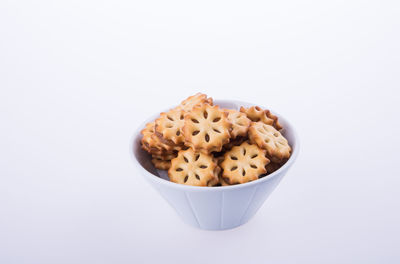 Close-up of breakfast served in bowl against white background