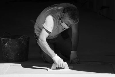 Rear view of man working