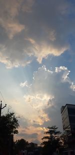 Low angle view of silhouette buildings against sky during sunset