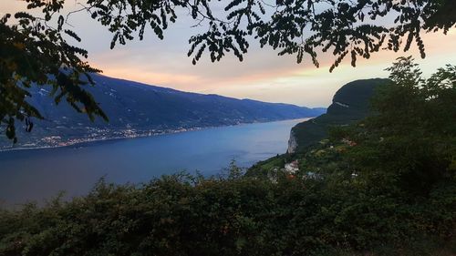 Scenic view of lake against sky during sunset