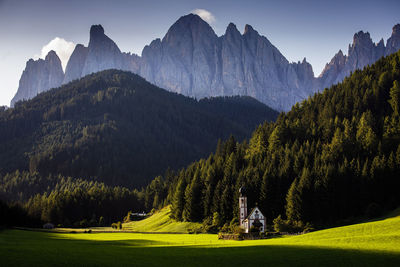 Ranui church from dolomites with scenic view of mountains against sky