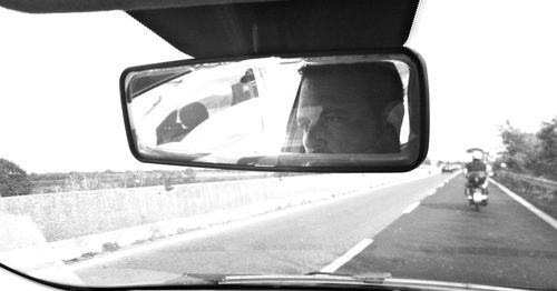 Reflection of car on road