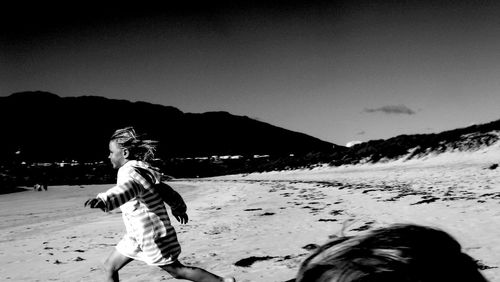 Woman standing on beach