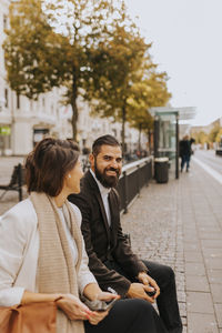 Smiling business people talking