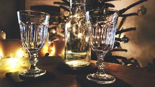 Close-up of wine glasses on table