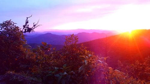 Scenic view of mountains against sky during sunset