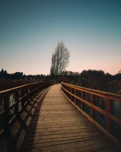 Pier over river against sky