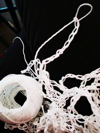 Close-up of rope tied on table