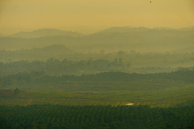 Scenic view of landscape against sky during sunset