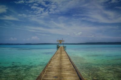 Pier over sea against sky