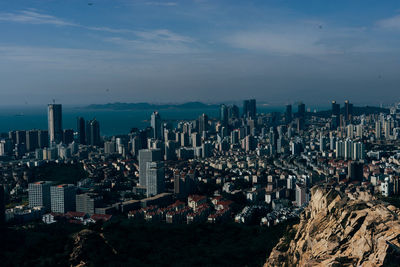 Aerial view of cityscape against sky