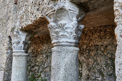 Low angle view of statue against wall