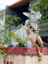 Close-up of animal statue against plants