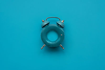 Close-up of electric lamp against blue background