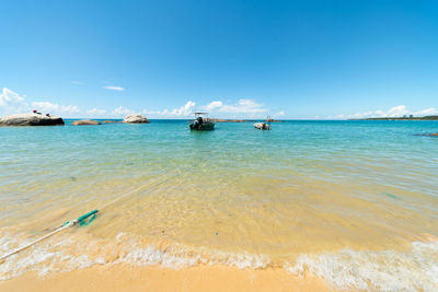 Scenic view of sea against blue sky