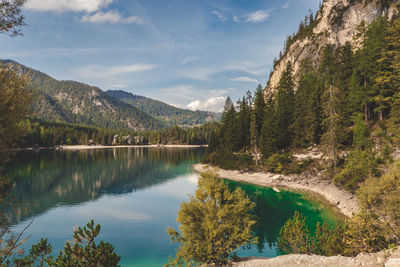 Scenic view of lake and mountains against sky