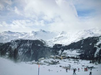 Snowcapped mountains against sky