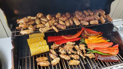 High angle view of meat on barbecue grill
