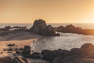 Scenic view of sea against clear sky during sunset