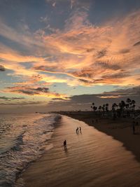 Scenic view of beach against sky during sunset