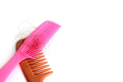 Close-up of pink cake against white background