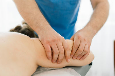 Midsection of doctor giving massage