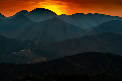 Scenic view of mountains against sky during sunset