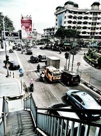 View of cars on street in city