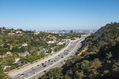 High angle view of road in city against clear sky