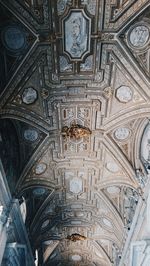 Low angle view of ornate ceiling of building