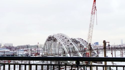 Low angle view of ferris wheel in city