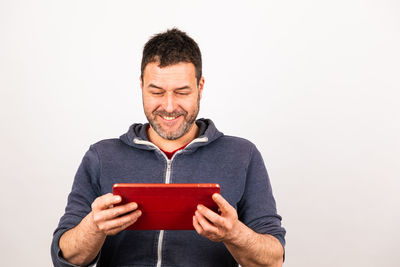 Man holding book against white background