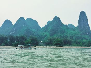 Scenic view of boats in sea