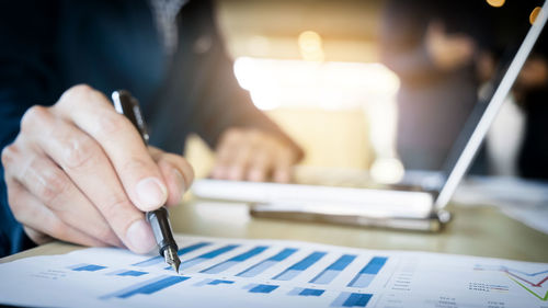 Close-up of man working on table