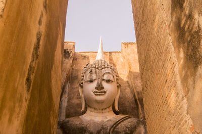 Statue of buddha against sky