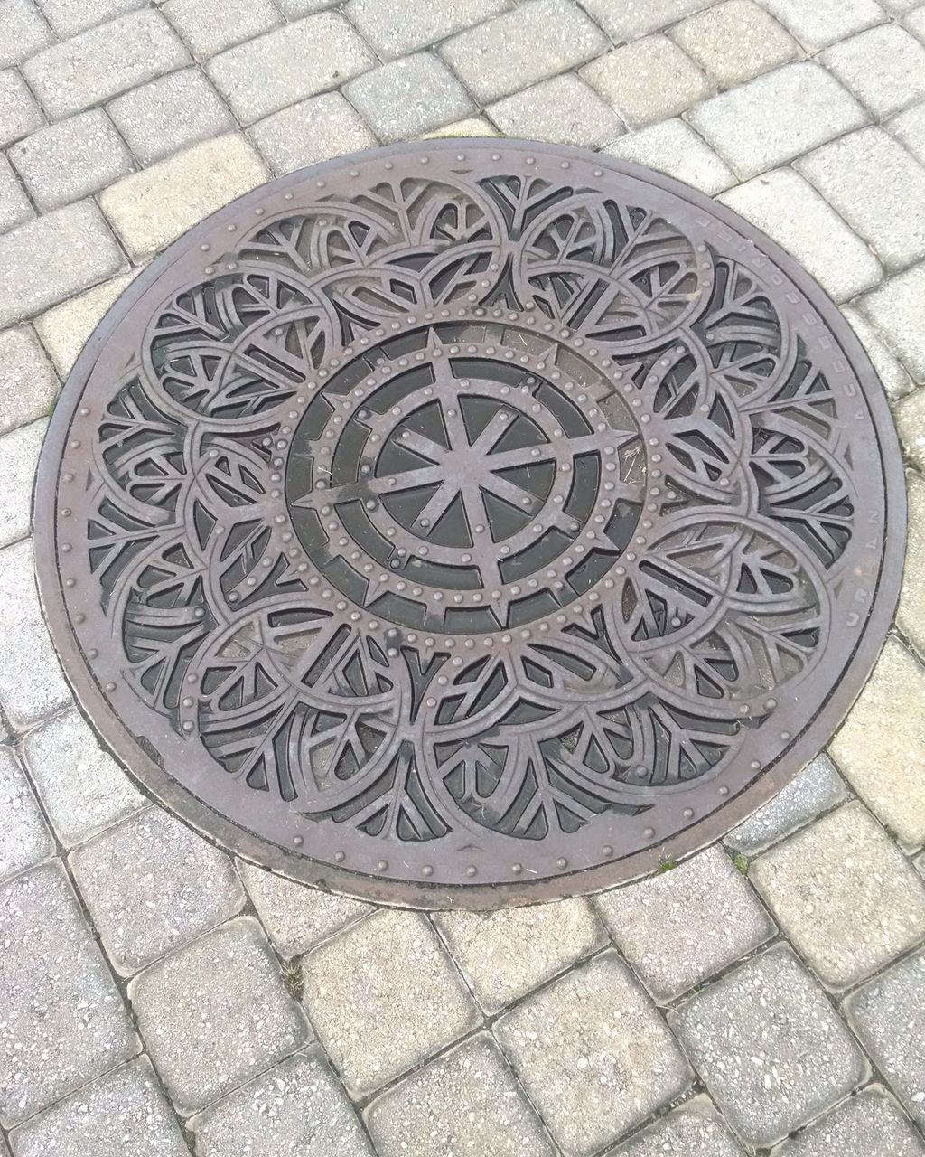 HIGH ANGLE VIEW OF MANHOLE