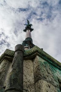 Low angle view of church against cloudy sky