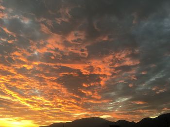 Low angle view of dramatic sky during sunset