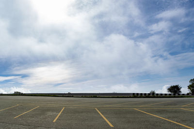 Airport runway against sky