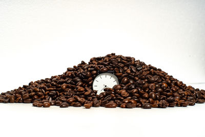 Close-up of coffee beans against white background